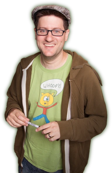 Steve Gadlin, pictured on his own website, smiling and holding a pen while wearing a shirt with a simple cat drawing.